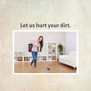Woman cleaning a wooden floor with a mop
