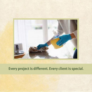 Person cleaning a kitchen countertop with spray and cloth