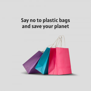 Colorful reusable shopping bags with text promoting reducing plastic bag use.