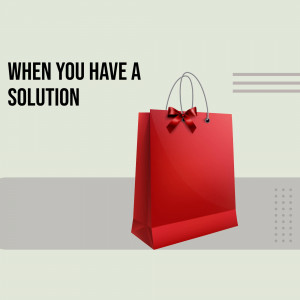 Red shopping bag with a bow and text 'When you have a solution'