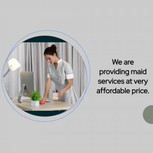 A maid cleaning a desk in a home office.
