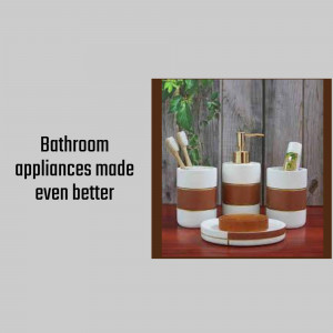 White and gold bathroom accessories set on a wooden surface