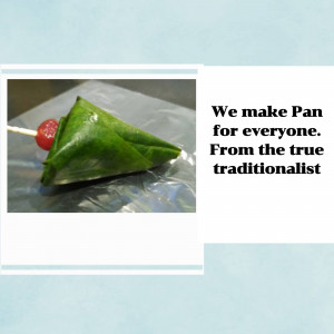 A close-up of a traditional Indian Pan (betel leaf preparation) with a cherry on top, presented on a plastic surface.