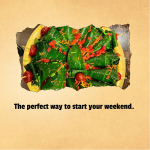 Close-up of a creatively presented paan appetizer with cherry tomatoes and spices.