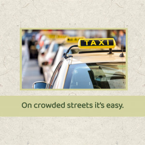 A row of yellow taxis on a city street with the text 'On crowded streets it's easy.'