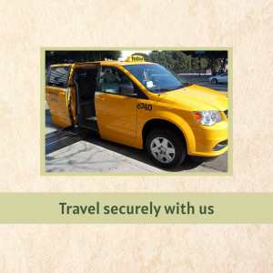 A yellow taxi cab with the door open, parked on a street.