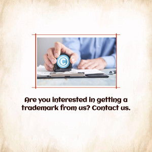 Hand stamping a copyright symbol on documents with text asking about trademark registration.