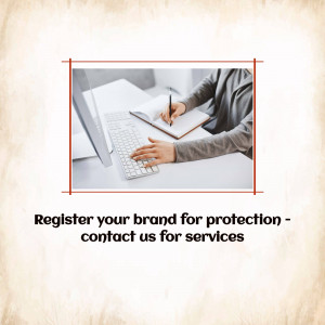 Person writing in a notebook while using a computer, with text promoting brand protection services.