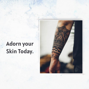 Close-up of a mandala tattoo on a man's arm