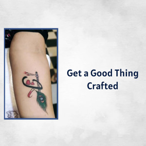 Close-up of a tattoo on an arm featuring a musical instrument and hearts