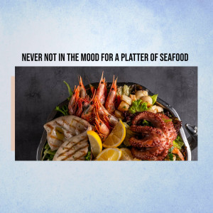 A vibrant and appetizing seafood platter with various shellfish and fish.