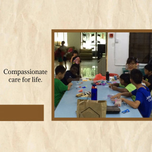 Children engaged in an activity with caregivers in a community setting.