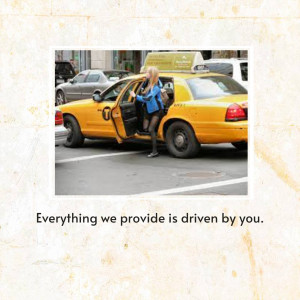 Woman exiting a yellow taxi cab in New York City