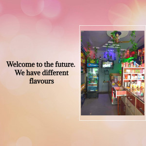 Interior view of a small ice cream shop with colorful decorations and a variety of flavors.