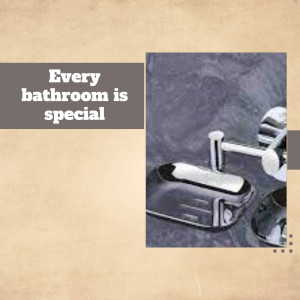 Close-up of modern chrome bathroom accessories including a soap dispenser and soap dish.