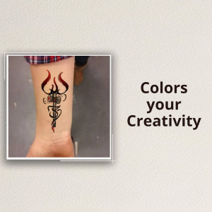 Close-up of a black trident tattoo on a person's wrist.