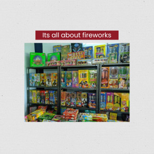 A store shelf filled with various types of fireworks boxes.