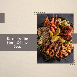 Overhead view of a large seafood platter with various grilled and cooked seafood items.