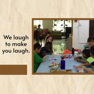 A group of children engaged in a crafting activity, with text 'We laugh to make you laugh.'