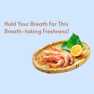 A woven tray with fresh shrimp, lemon, and basil