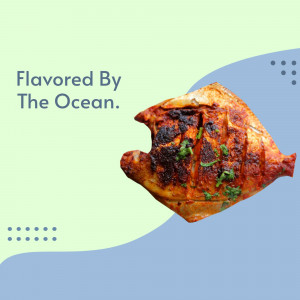 Close-up of a beautifully grilled fish with herbs, presented against a pastel blue and green background.