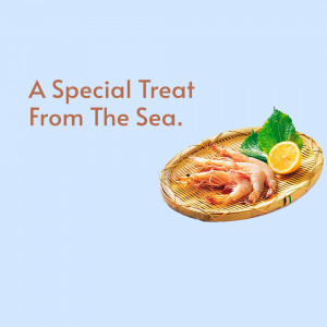 Shrimp on a woven tray with lemon and greens