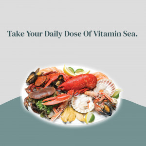 A platter of various seafood including lobster, crab, mussels, and salmon.