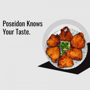 A plate of golden-brown fried fish with a lemon wedge and green garnish.