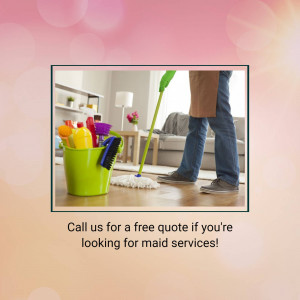 Person cleaning a wooden floor with a mop and bucket of cleaning supplies