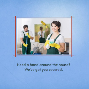 Two cleaning professionals smiling and holding cleaning supplies in a living room.