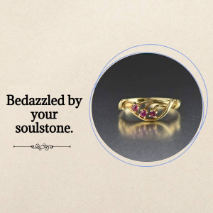 Close-up of a gold ring with three ruby gemstones