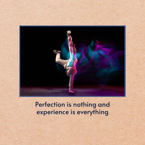 A person performing a handstand with colorful smoke effects in the background.