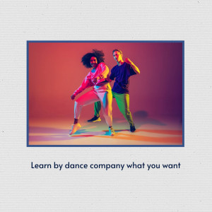 Two people dancing energetically in a vibrant, colorful setting.