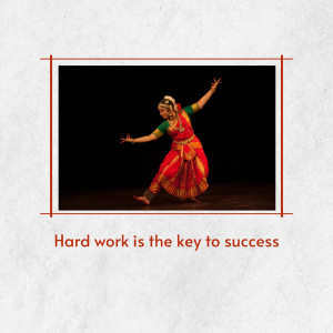 A woman performing a traditional Indian classical dance on a dark stage.