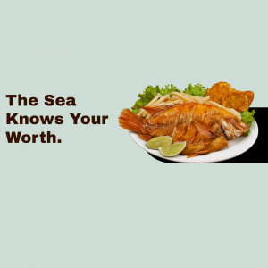 A plate of fried fish with french fries, lettuce, and lime wedges.