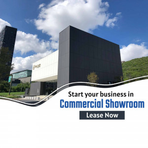 Modern commercial showroom building with a promotional banner for leasing.