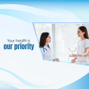 Two female healthcare professionals talking to a patient in a modern clinic.