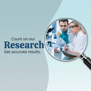 Scientists examining a petri dish through a magnifying glass