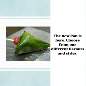 A close-up of a traditional Indian paan with a cherry on top.