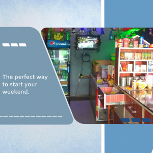 Interior view of a small local shop with a Pepsi refrigerator and shelves stocked with goods.