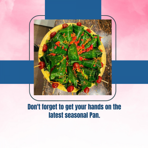 Close-up of a beautifully arranged Pan dish with vibrant green betel leaves and red toppings.