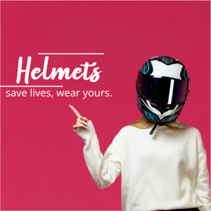 A person wearing a white sweater points to a motorcycle helmet.