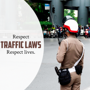Traffic police officer directing traffic with a message to respect traffic laws and lives.