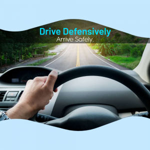 Hands on steering wheel with a road view, promoting defensive driving.