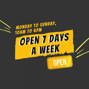 Yellow sign with text 'Open 7 Days a Week' and business hours.