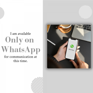 Hand holding a phone displaying the WhatsApp app with a coffee and laptop in the background.