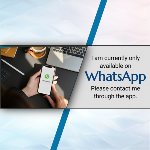 Image showing a hand holding a phone displaying the WhatsApp app, with a laptop and coffee nearby.