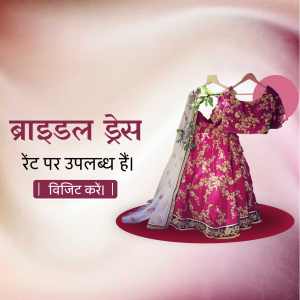 Red and gold embroidered bridal lehenga choli with dupatta on a hanger