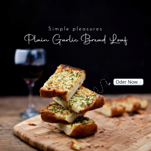 Close-up of a stack of garlic bread slices with a glass of red wine