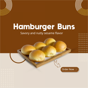 Close-up of golden brown hamburger buns on a wooden tray